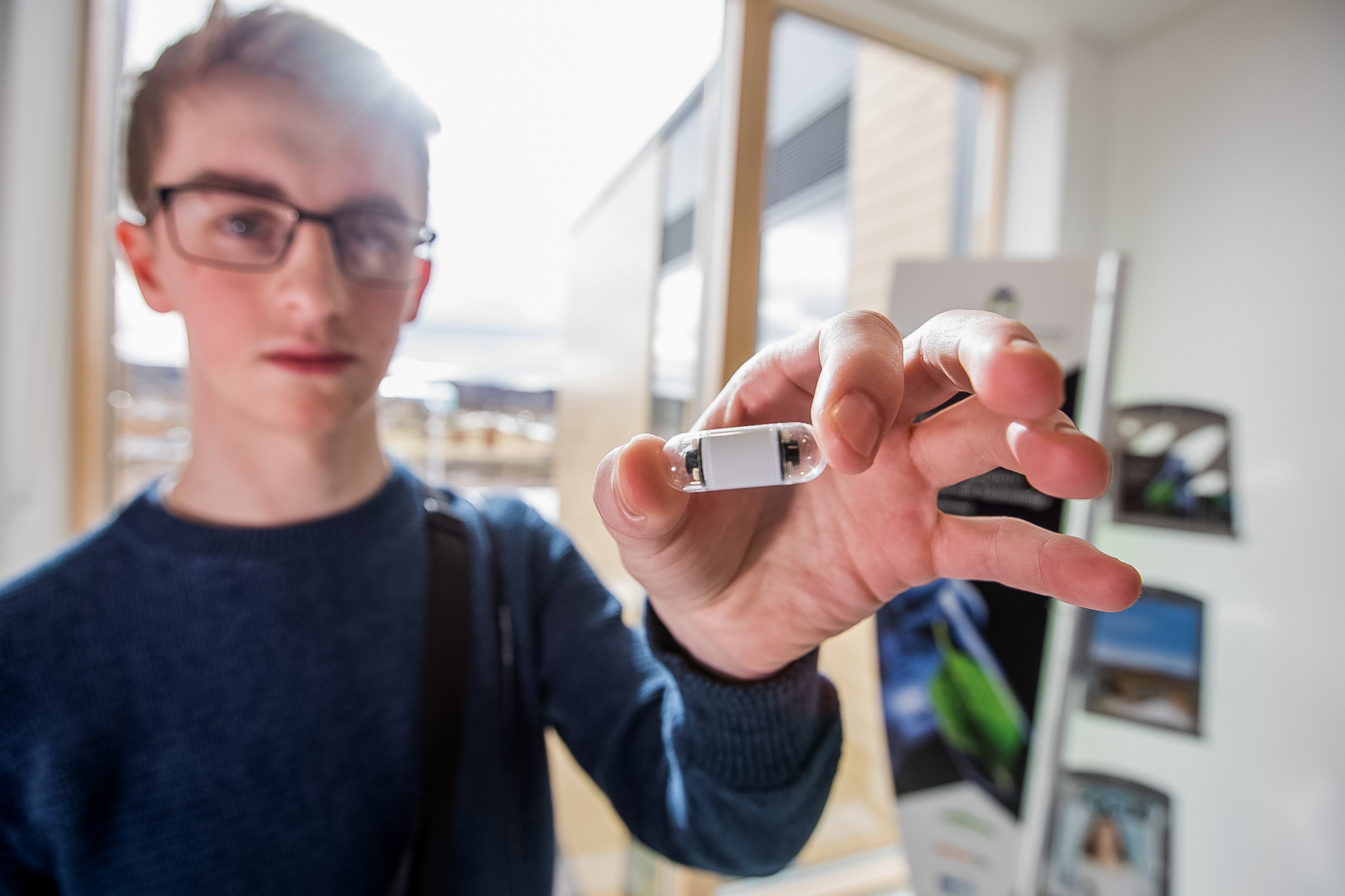 Man showing the medical device from Corporate Health